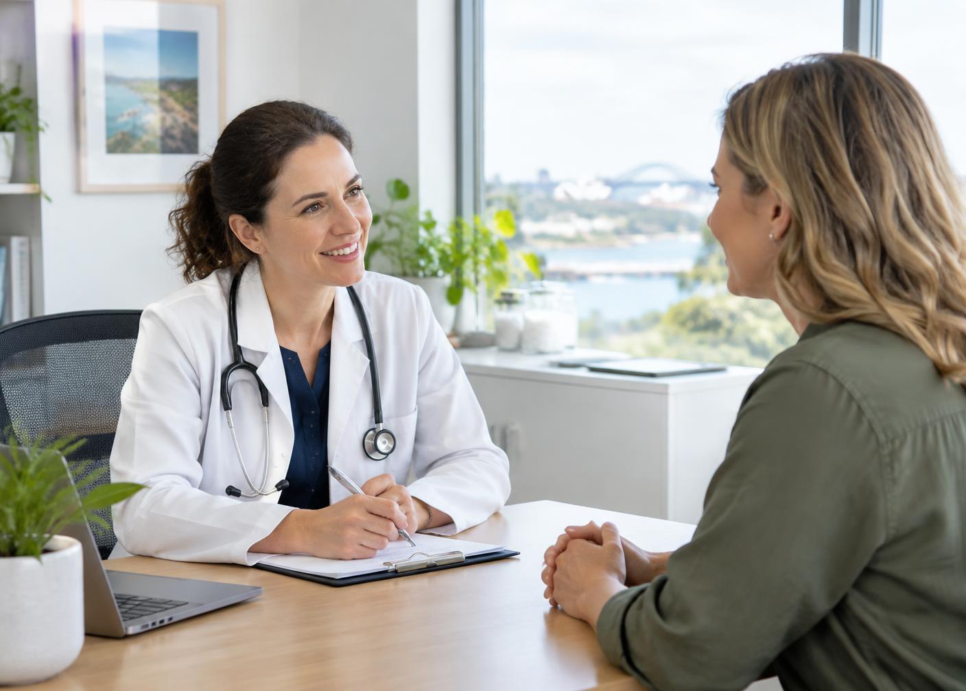 A female doctor in consultation with a female patient